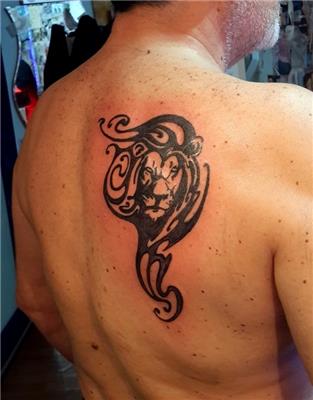 sirta-tribal-aslan-dovmesi---tribal-lion-tattoo-on-back