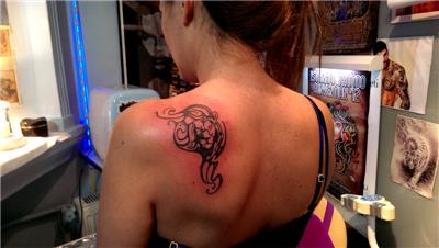 sirta-tribal-aslan-dovmesi---tribal-lion-tattoo-on-back